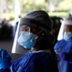 Florida reported more than 15,000 new covid-19 cases on Sunday, a new national record. Above, healthcare workers wait for people at a covid-19 drive-though testing site in St. Petersburg, Florida on July 9.